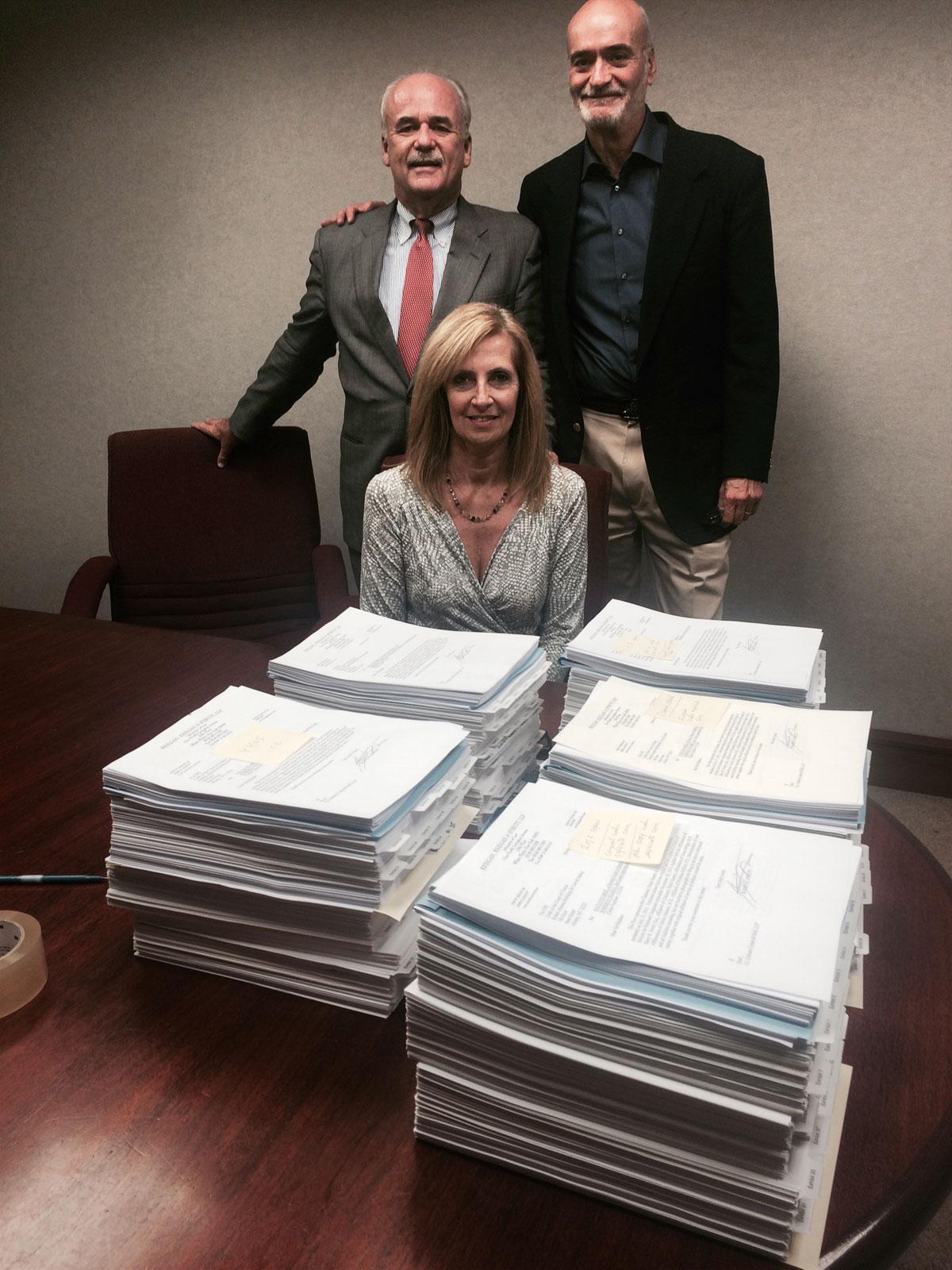 White Plains personal injury lawyers, John Keegan and Barry Strutt with their legal assistant, Lisa Logel